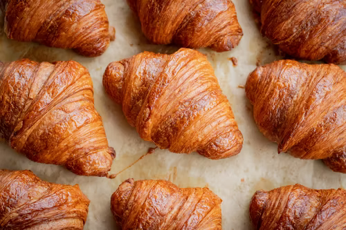 Freshly baked croissants with a fluffy exterior