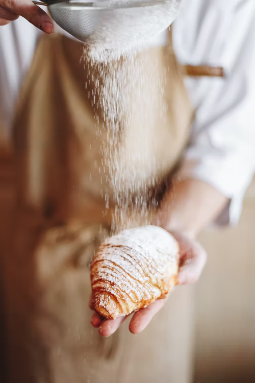 A baker making the perfect croissant