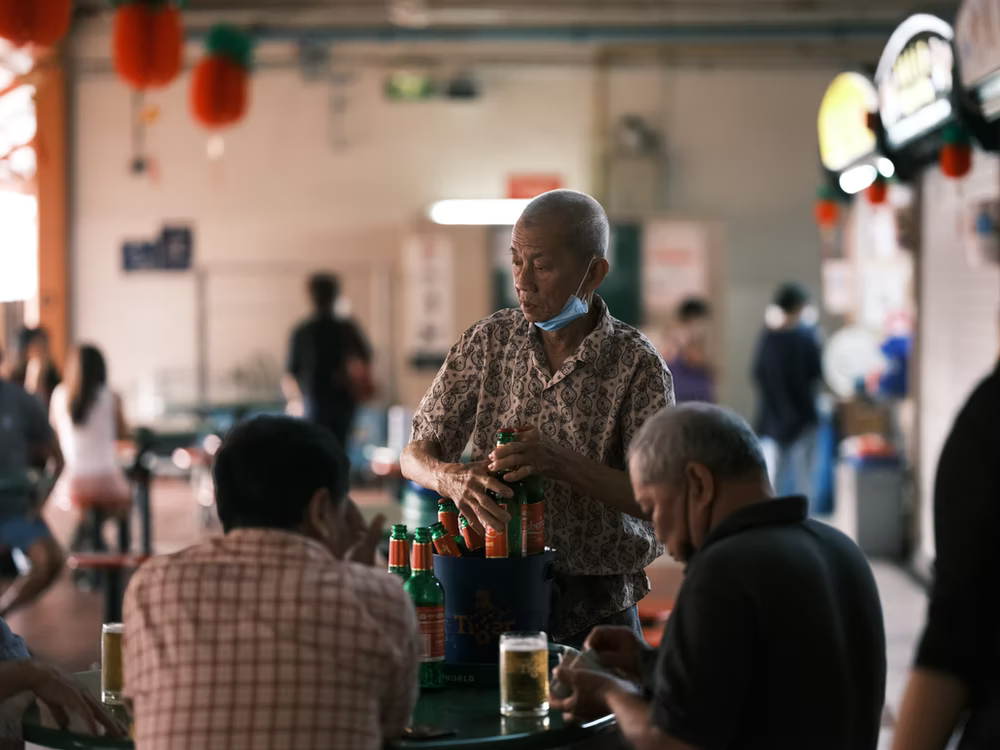  People eating at a hawker center in Singapore