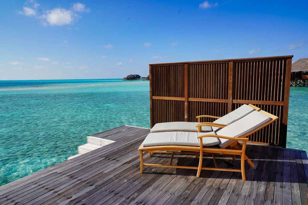 Two chairs and an umbrella on a beach
