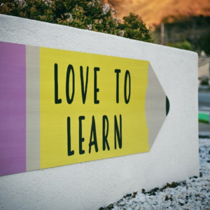 A sign saying love to learn