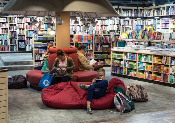 people reading inside a library