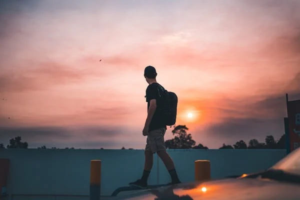 a man looking at the sunset