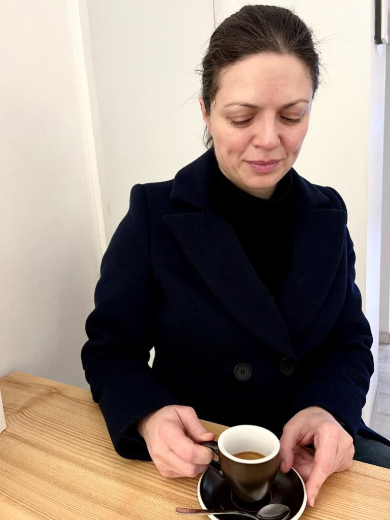Irina Bukatik drinking coffee in Klaipeda