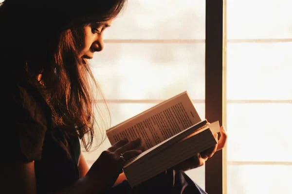 a girl reading a book