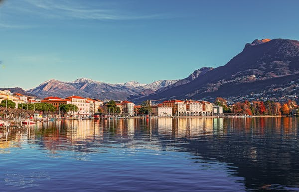 a lake in front of mountains