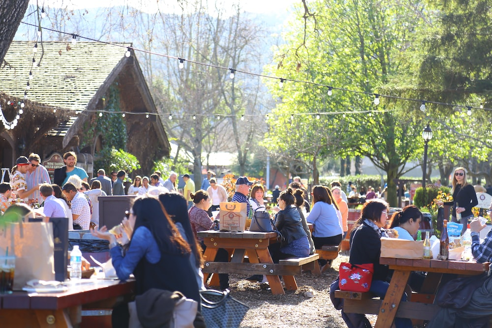 People Sitting Outside at a Wine Tasting in Napa