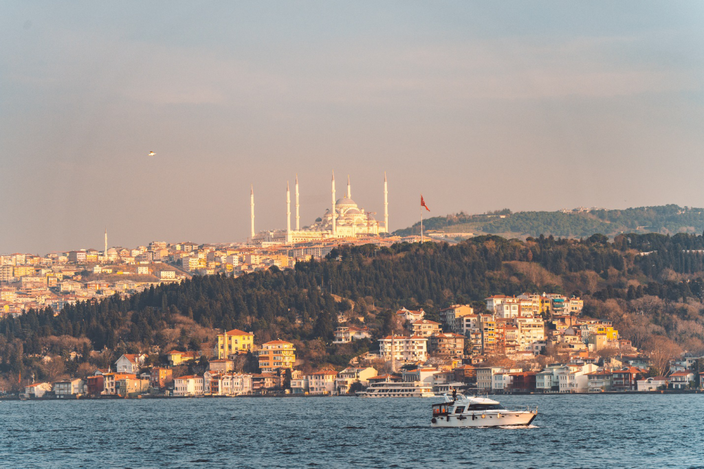 a skyline shot of Istanbul, Turkey with a view of the Çamlıca Mosque from the Bosphorus strait