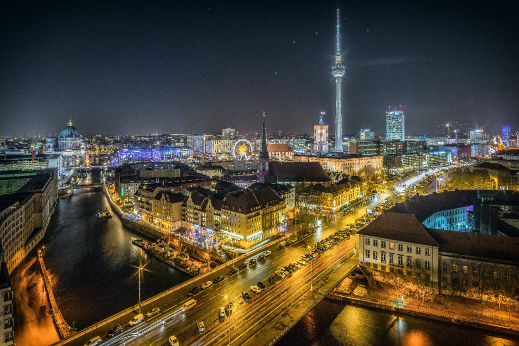 a picture of Berlin at night with a view of the Berlin tower
