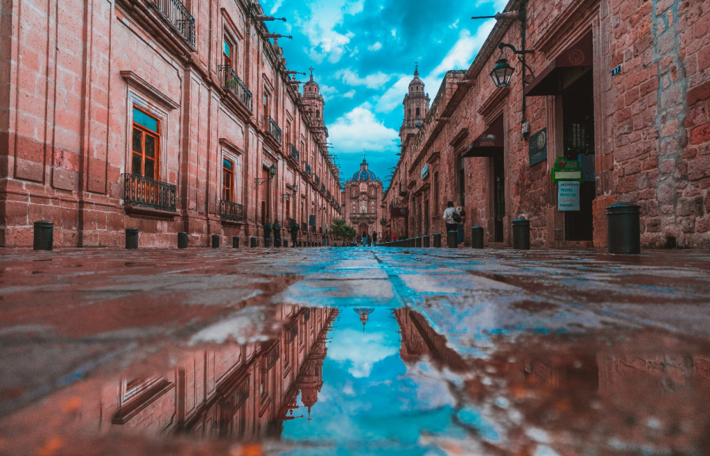 a picture of an empty street in Morelia, Mexico against the backdrop of a blue sky